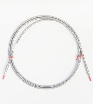 a coiled fiber patch cable, silver colored flexible spiral protective sheath