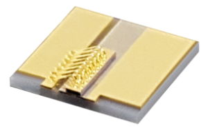 gold colored square plate with diode chips and electrical connectors