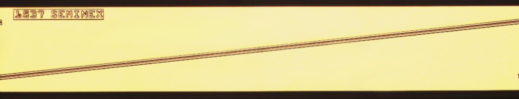 gold colored semiconductor tilted waveguide - long rectangle with single angled line