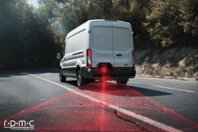 white van with a laser mounted to the rear, scanning the roadway for hazards and defects